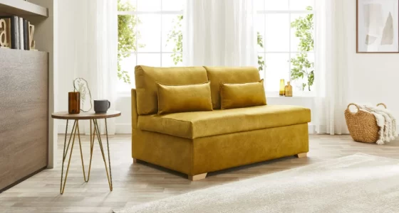 Sofabed.co.uk mustard yellow sofa in room with natural light coming through windows behind