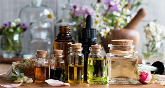 Advanced Alternatives Center essential oils on wooden board